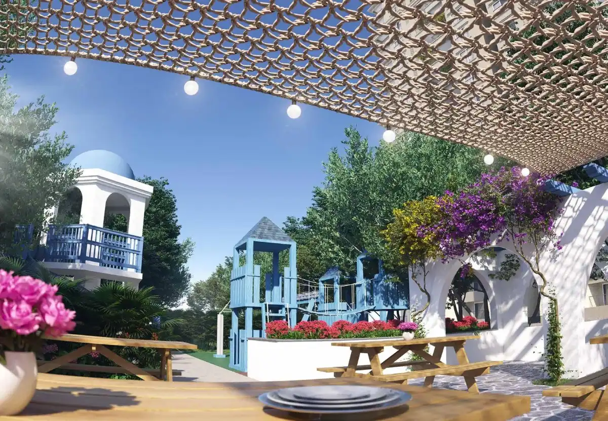 Landscaped park area at Sobha Neopolis featuring green open spaces, walking paths, and modern residential towers