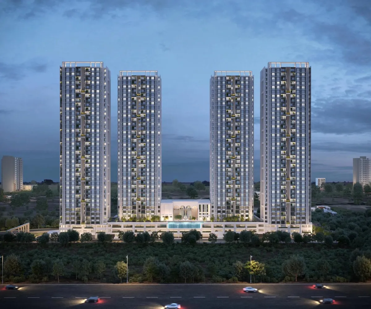 Sobha Townpark high-rise residential tower illuminated at night with palm trees and modern balconies